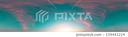 Sunset sky with bright glowing pink Cirrus clouds. Seamless spherical HDR 360 panorama. Full zenith or sky dome in 3D, sky replacement for aerial drone panoramas. Climate and weather change. 134441224