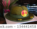 Military hat shaped cake with star and emblem in buffet at Ba Na Hills Vietnam decorated for veterans or military themed celebration dessert display. 134441458