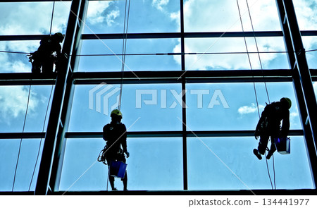 extreme work cleaning airport windows at height 134441977