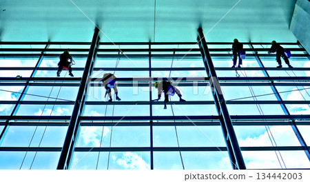 extreme work cleaning airport windows at height 134442003