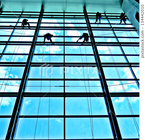 extreme work cleaning airport windows at height 134442010