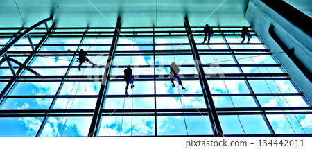 extreme work cleaning airport windows at height 134442011