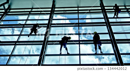 extreme work cleaning airport windows at height 134442012