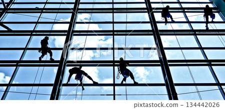 extreme work cleaning airport windows at height 134442026