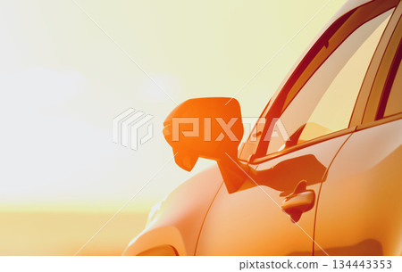 A silver car with the morning sun in the background 134443353