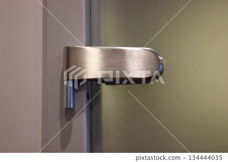 Modern metal door handle interior detail Modern metal door handle interior detail 134444035