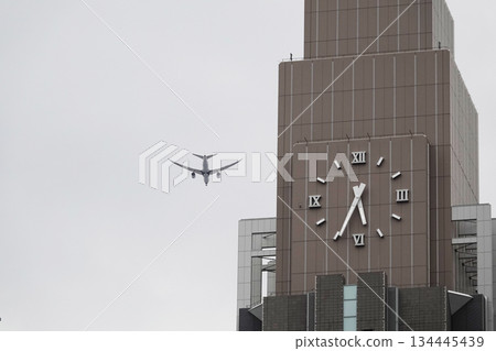 Skyscrapers and flying passenger planes 134445439