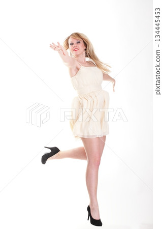 Young female Happy woman jumping with arms up isolated 134445453