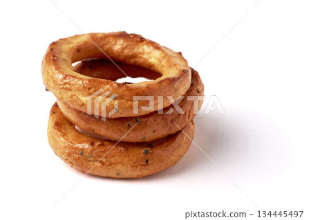A pyramid of salted pretzels with poppy seeds isolated on a white background. 134445497