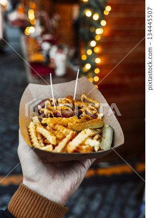 Currywurst and Fries in a Paper Tray at a European Street Food Market 134445507