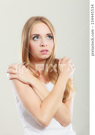 Shy girl, afraid woman on gray Shy girl, afraid woman on gray 134445534