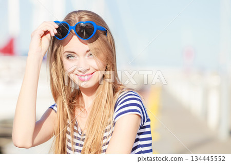 woman in marina against yachts in port woman in marina against yachts in port 134445552