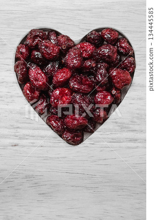 dried cranberry fruit heart shaped on wood board dried cranberry fruit heart shaped on wood board 134445585