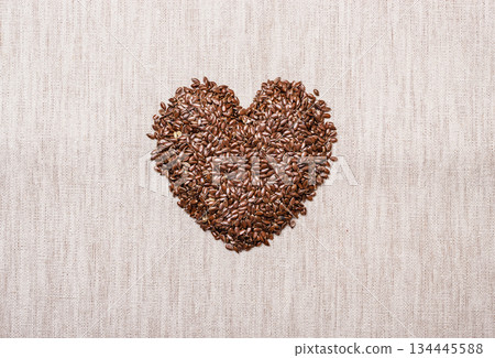 Raw flax seeds linseed heart shaped Raw flax seeds linseed heart shaped 134445588