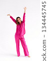 Happy Woman In Bright Pink Pajama Set 134445745