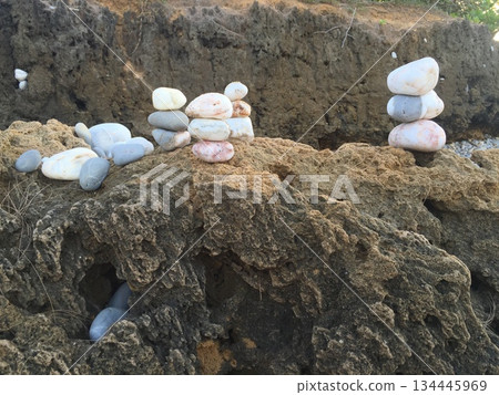 Stones pebbles stacked on the beach 134445969
