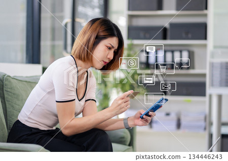 Woman hand holding smartphone and using credit card for online shopping. Woman hand holding smartphone and using credit card for online shopping. 134446243
