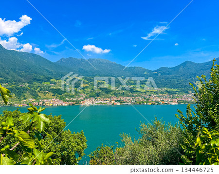 View of Iseo Lake Surrounded by Majestic Mountains and Clear Blue Skies, Italy View of Iseo Lake Surrounded by Majestic Mountains and Clear Blue Skies, Italy 134446725