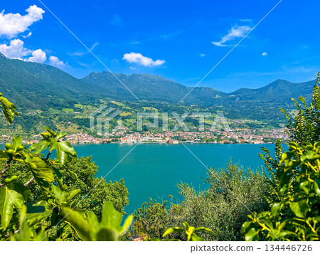 View of Iseo Lake Surrounded by Majestic Mountains and Clear Blue Skies, Italy View of Iseo Lake Surrounded by Majestic Mountains and Clear Blue Skies, Italy 134446726