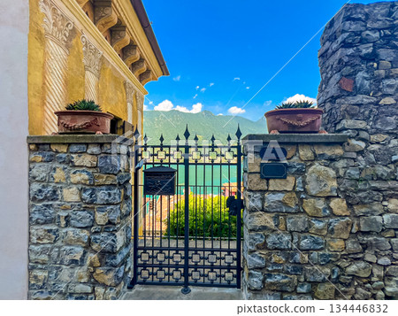 Intricate Ornate Metal Gate with View of Mountains and Iseo Lake, Italy Intricate Ornate Metal Gate with View of Mountains and Iseo Lake, Italy 134446832