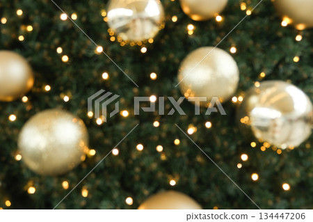 Festive Christmas Bokeh Background with Golden Ornaments and Sparkling Lights. Festive Christmas Bokeh Background with Golden Ornaments and Sparkling Lights. 134447206