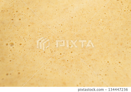 Abstract macro texture of bubbly waffle batter. Abstract macro texture of bubbly waffle batter. 134447236