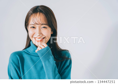 woman in blue knit woman in blue knit 134447251