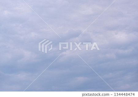 Overcast sky with soft, cloudy layers in tranquil grey and blue tones creating Overcast sky with soft, cloudy layers in tranquil grey and blue tones creating 134448474