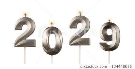 Burning number candles 2029 representing New Year, hope, joy, and bright beginning isolated on white Burning number candles 2029 representing New Year, hope, joy, and bright beginning isolated on white 134448656