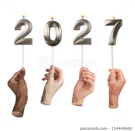 Close-up of hands holding bright 2027 candles symbolizing festive New Year atmosphere, celebration 134448660