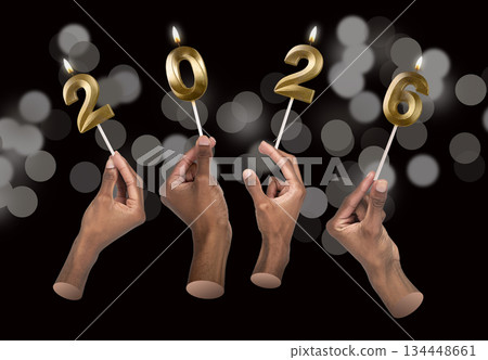Close-up view of hands with glossy 2026 number candles symbolizing New Year celebration, joy and 134448661