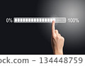 Loading bar progress concept. Female hand touching digital screen from 0 to 100 percent, symbol of 134448759