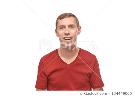 Young caucasian male smiling in red t-shirt on white background Young caucasian male smiling in red t-shirt on white background 134449060