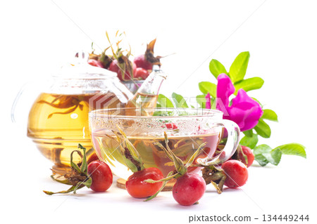 hot natural tea and rose hips on a white background 134449244