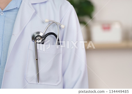 Doctor with Stethoscope in Pocket, Ready for Consultation Doctor with Stethoscope in Pocket, Ready for Consultation 134449485