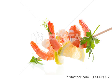 Boiled red shrimps with lemon on white background 134449907