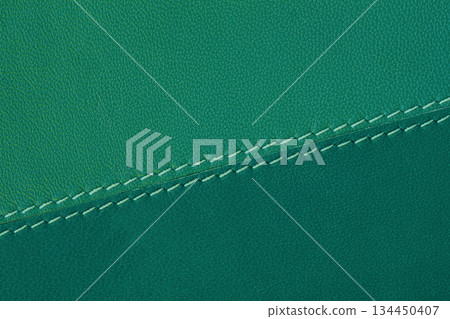 Close-up of teal green leather surface with visible stitching and soft matte finish. Natural modern background for fashion, bags, upholstery. Color of the Year, copy space Close-up of teal green leather surface with visible stitching and soft matte finish. Natural modern background for fashion, bags, upholstery. Color of the Year, copy space 134450407