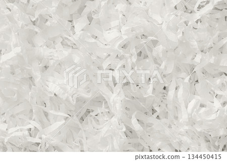 White shredded paper texture with curled strips creating light, festive surface for packaging, craft, design background. Concept of celebration, eco design, soft volume. Modern Cloud Dancer color 134450415
