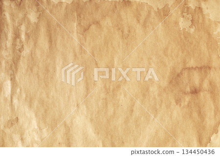 Weathered kraft parchment with visible brown stains Weathered kraft parchment with visible brown stains 134450436