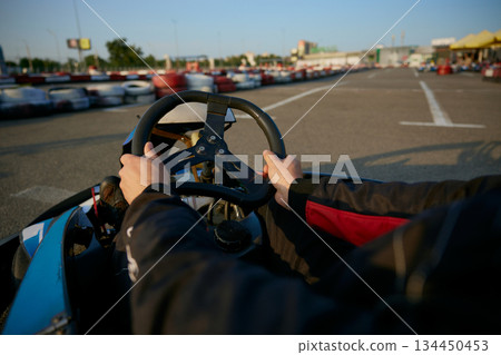 The thrilling view from the drivers seat of a gokart 134450453