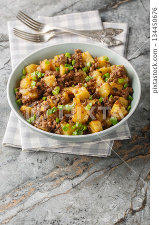 Ground Beef and Potato Stir-Fry closeup on the plate. Vertical Ground Beef and Potato Stir-Fry closeup on the plate. Vertical 134450676