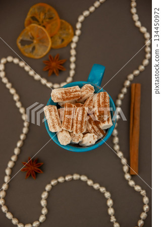 Coffee with marshmallows and carcin and star anise. 134450972