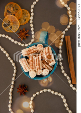 Coffee with marshmallows and carcin and star anise. Coffee with marshmallows and carcin and star anise. 134450974