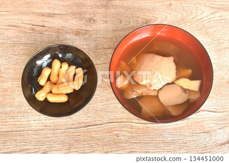 boiled hot tofu pudding in ginger syrup on bowl with crispy deep-fried dough stick boiled hot tofu pudding in ginger syrup on bowl with crispy deep-fried dough stick 134451000