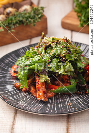 Spicy chicken salad with greens and vegetables 134452242