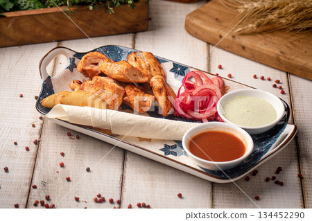 Grilled chicken kebab with dipping sauces Grilled chicken kebab with dipping sauces 134452290