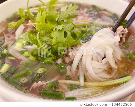 Vietnamese pho with beef: Rice noodles in a fragrant broth. Vietnamese pho with beef: Rice noodles in a fragrant broth. 134452506