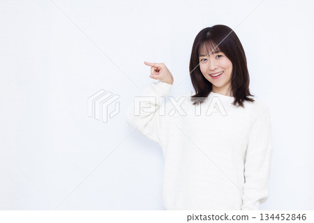 A woman holding his index finger A woman holding his index finger 134452846