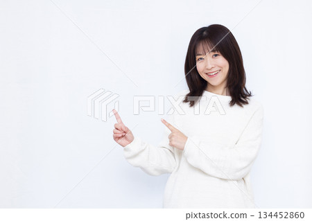 A woman holding his index finger 134452860