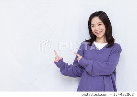 A woman holding his index finger A woman holding his index finger 134452868